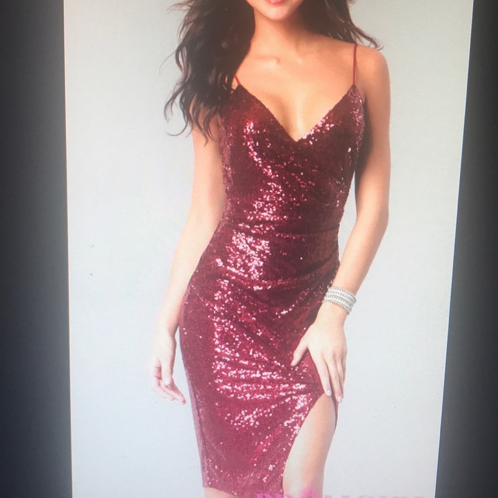 Knee length burgundy sequin dress with leg slit